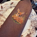 Elegant table linen napkin with creative embroidery design inspired by little deer