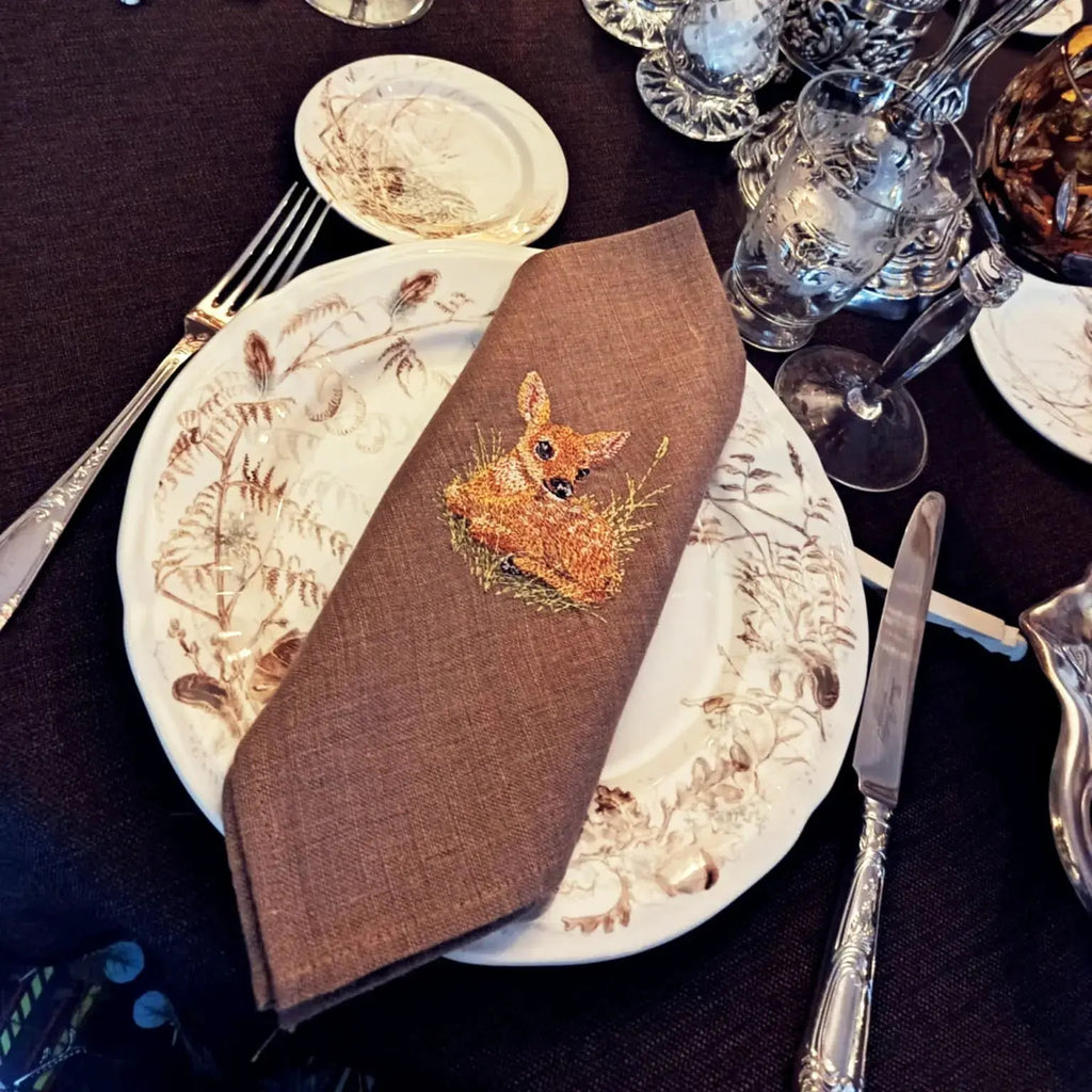 Elegant table linen napkin with creative embroidery design inspired by little deer