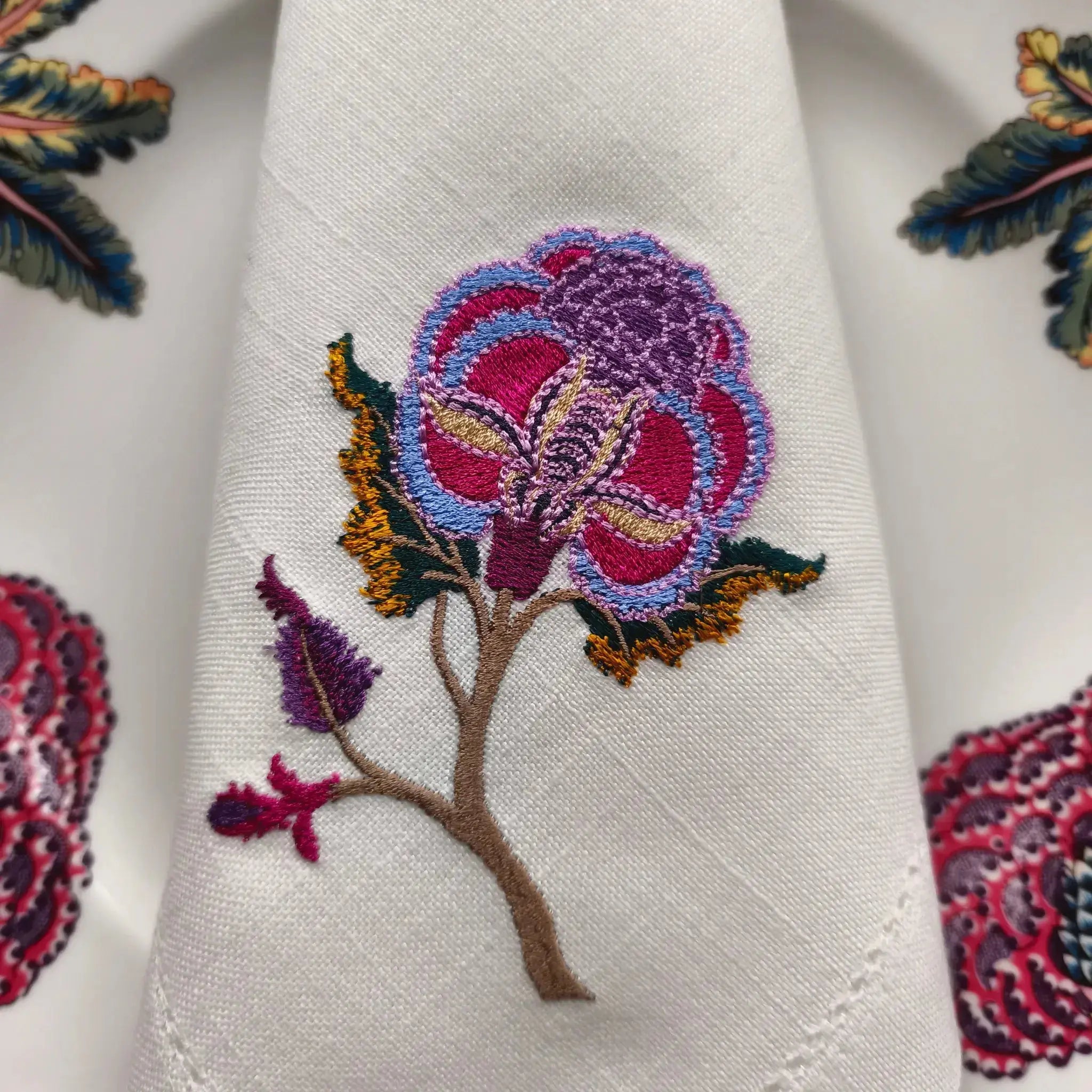 Embroidered linen dinner napkin with creative embroidery inspired by persian floral art
