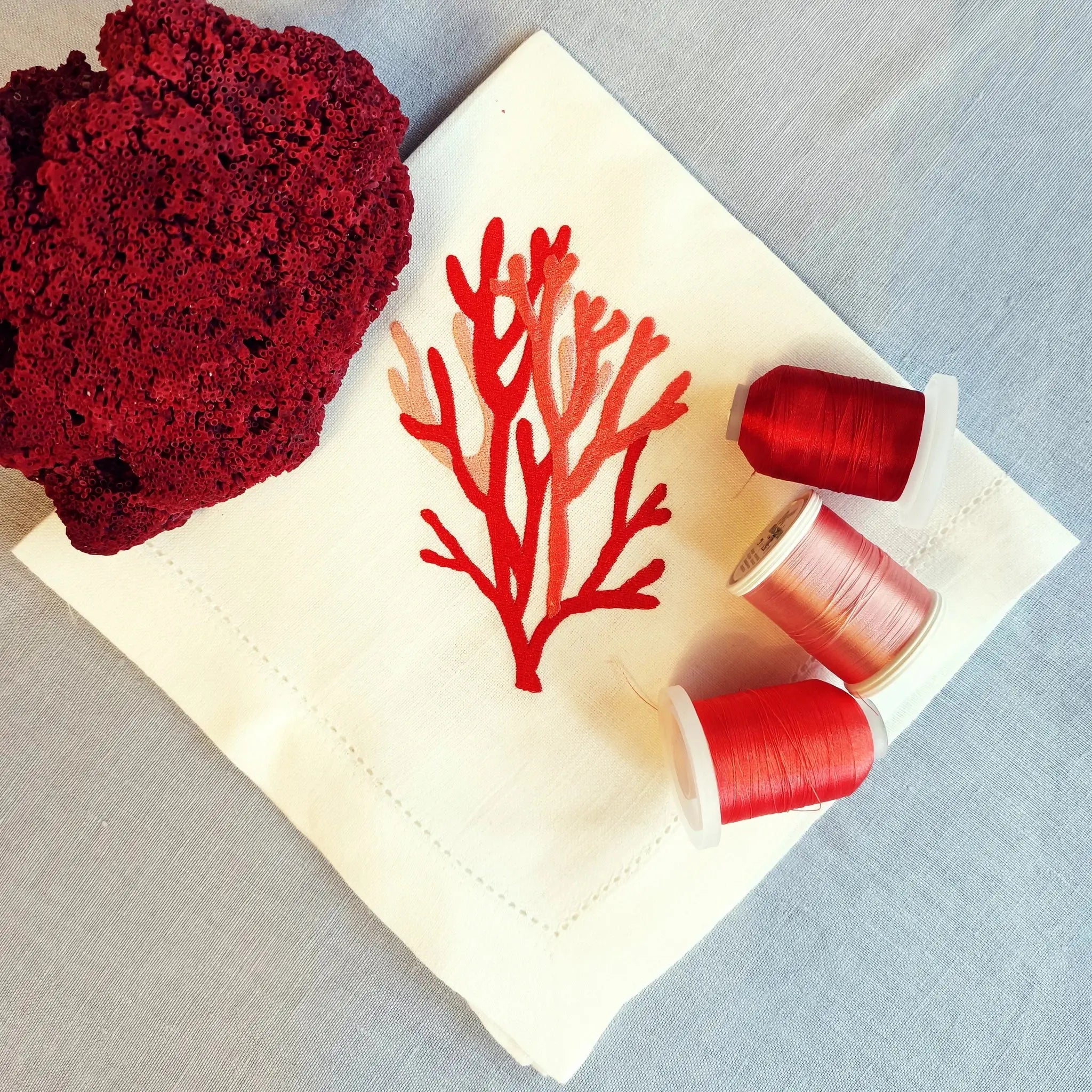 Elegant cotton linen table napkin with beautiful coral machine embroidery design