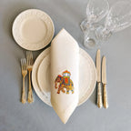 Embroidered linen dinner napkin with creative embroidery inspired by Indian decorated elephant