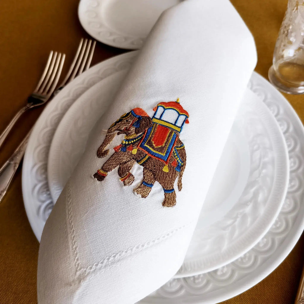 Embroidered linen dinner napkin with creative embroidery inspired by Indian decorated elephant