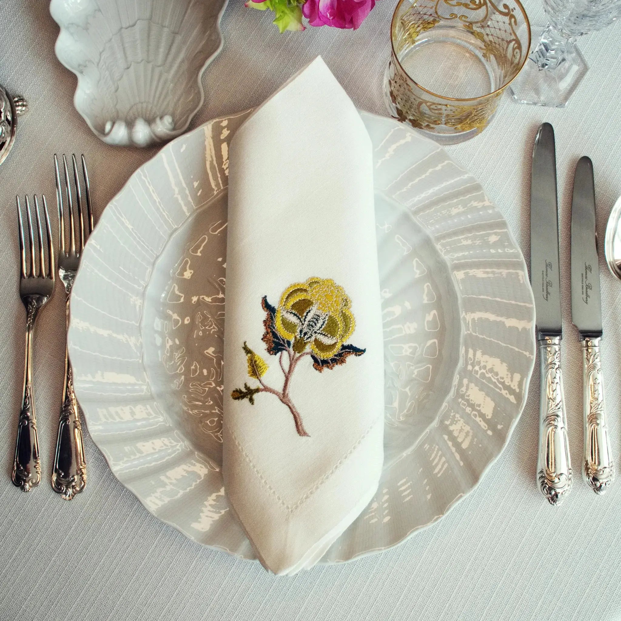 Embroidered linen dinner napkin with creative embroidery inspired by persian floral art