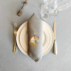 Embroidered linen dinner napkin with creative embroidery inspired by Arabian horse
