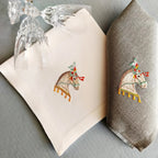 Embroidered linen dinner napkin with creative embroidery inspired by Arabian horse