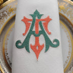 Embroidered linen dinner napkins with elegant monogrammed embroidery for fine dining table