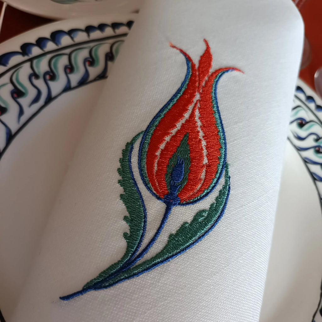 Embroidered linen dinner napkin with creative tulip embroidery inspired by eastern floral motif