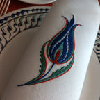 Embroidered linen dinner napkin with creative tulip embroidery inspired by eastern floral motif